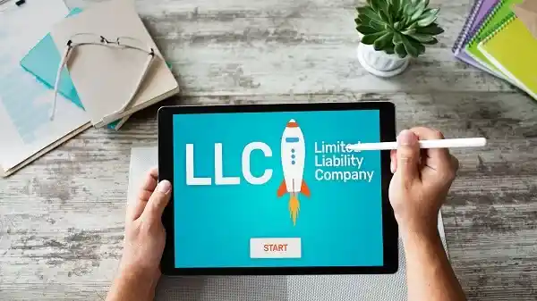 Founder registering a business on a laptop