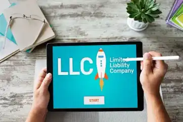 Founder registering a business on a laptop
